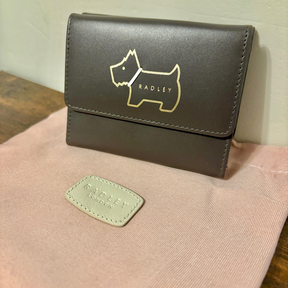 Authentic NWT Radley London small trifold Wallet.